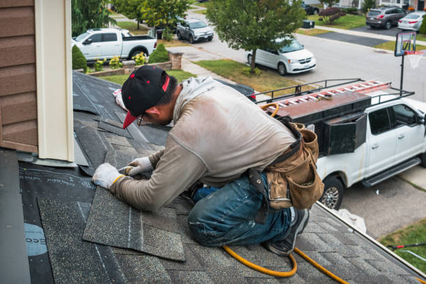 Professional Emergency Roof Repair technician working in Oelwein, IA